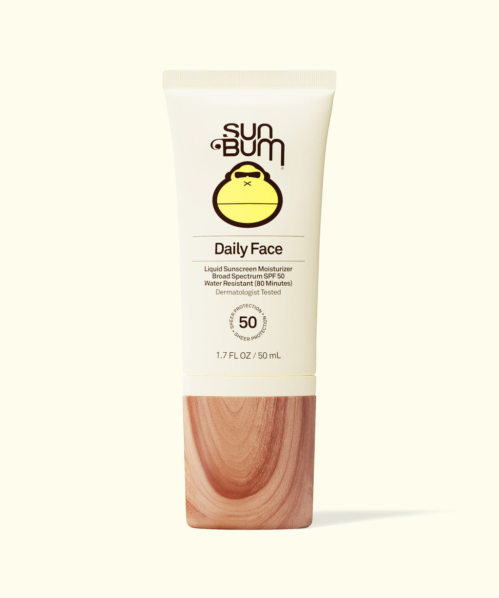Sun Bum Daily 50 Face Lotion with SPF 50 in a beige tube and wood-textured cap on light background