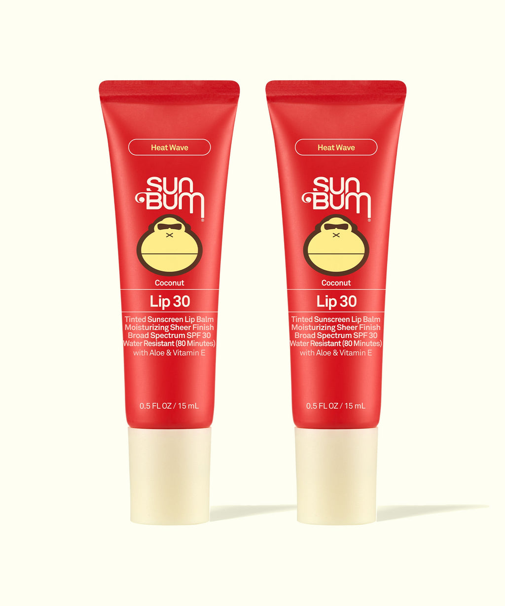 Two Sun Bum Heat Wave tinted lip balms in red tubes with beige caps shown side by side for Tinted Lip Duos.