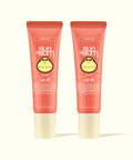 Two Sun Bum Sunset Cove Coconut Lip 30 tinted sunscreen lip balms in coral packaging, part of Tinted Lip Duos